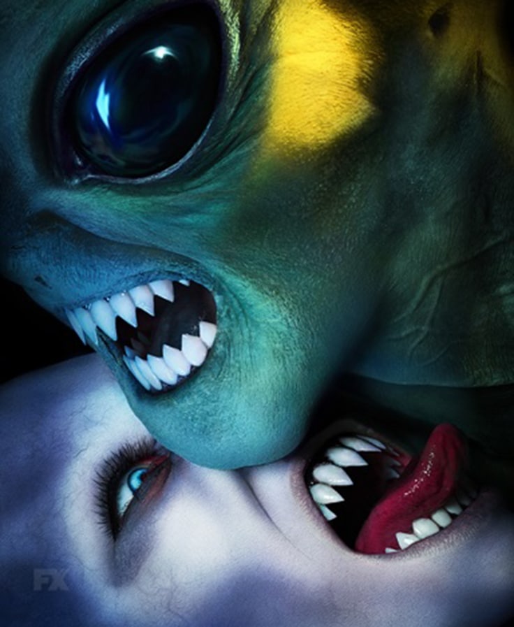 Fanged pale monster licking neck of fanged alien from FX's American Horror Story Double Feature