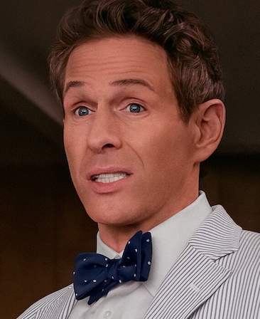 Glenn Howerton headshot wearing a striped shirt with collar and buttons