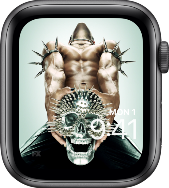 Apple Watch lock screen of man with black pants and spikes on arms clenching spiked metal skull for AHS NYC