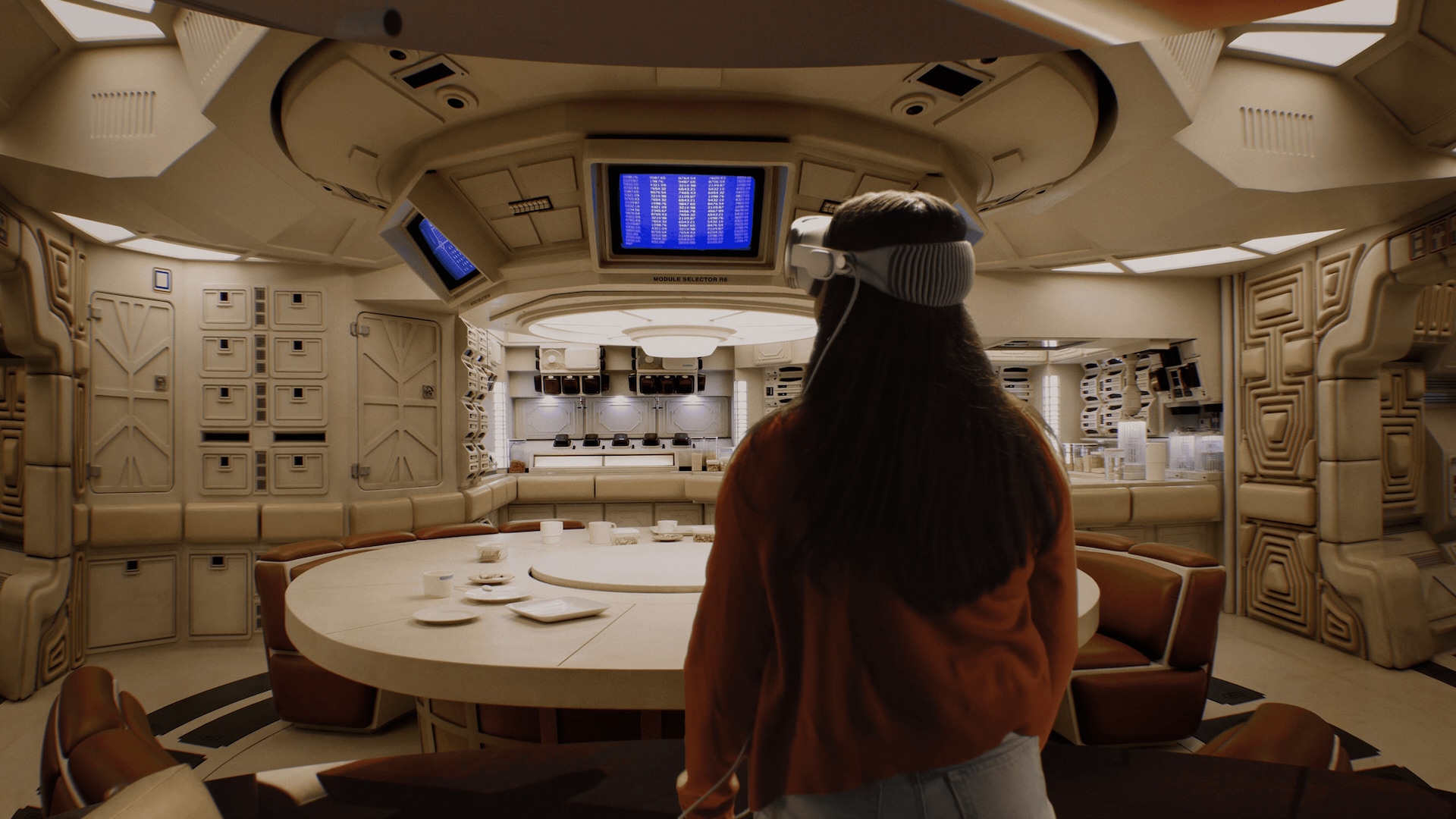 Person wearing Apple Vision Pro looking at a set from Alien: Earth.