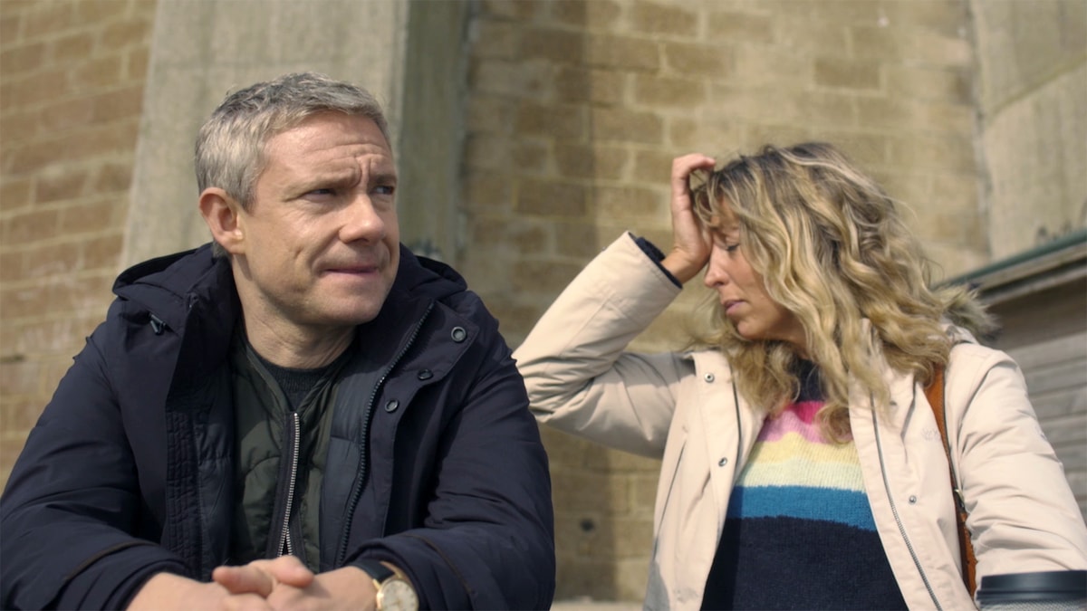 Paul sitting down looking concerned next to Ally holding hand to her forehead from Breeders FX show