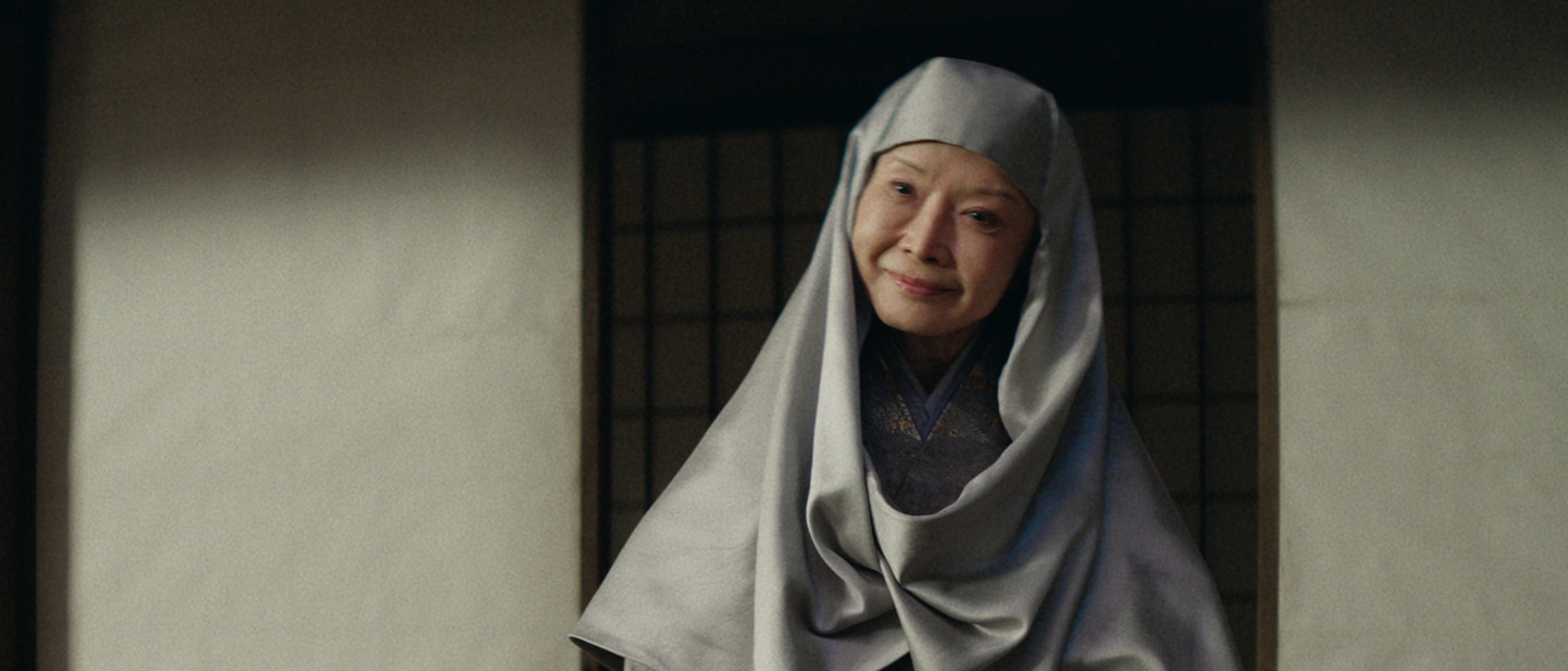 The nun Daiyoin stands in front of her bowed ladies-in-waiting on the set of FX's Shogun