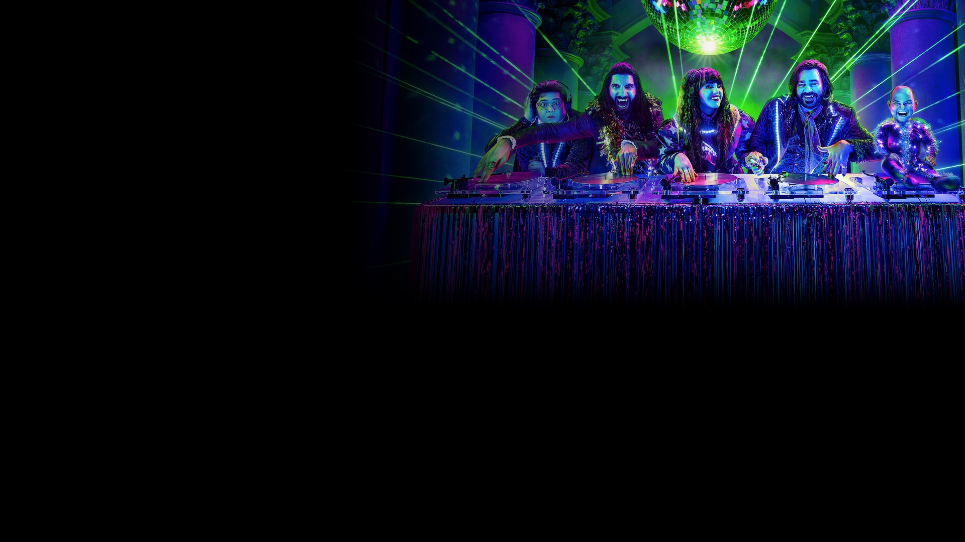 What We Do in the Shadows cast djing on a turn table with green lasers in purple effect