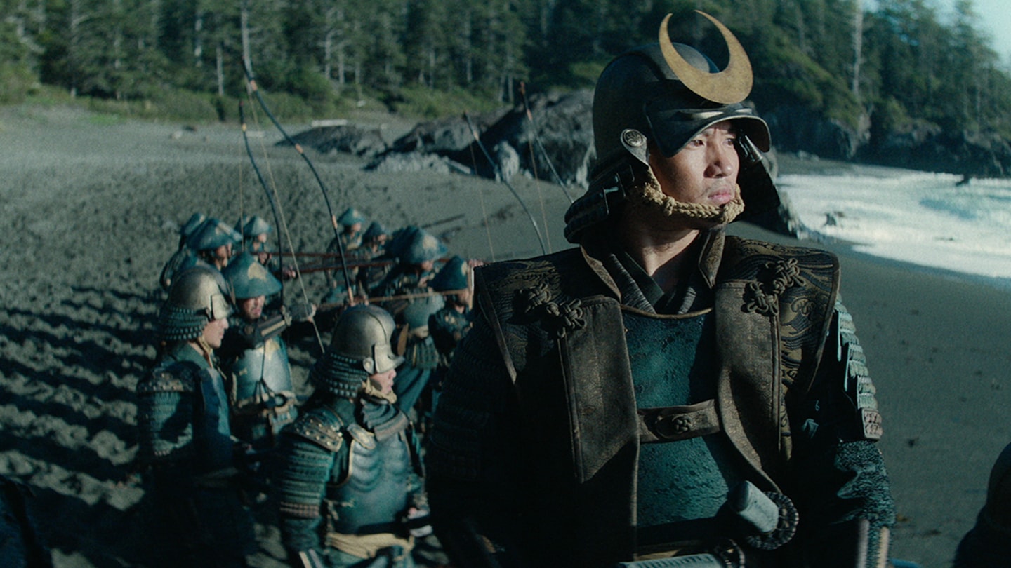 Omi wears armor and leads his samurai along the shore