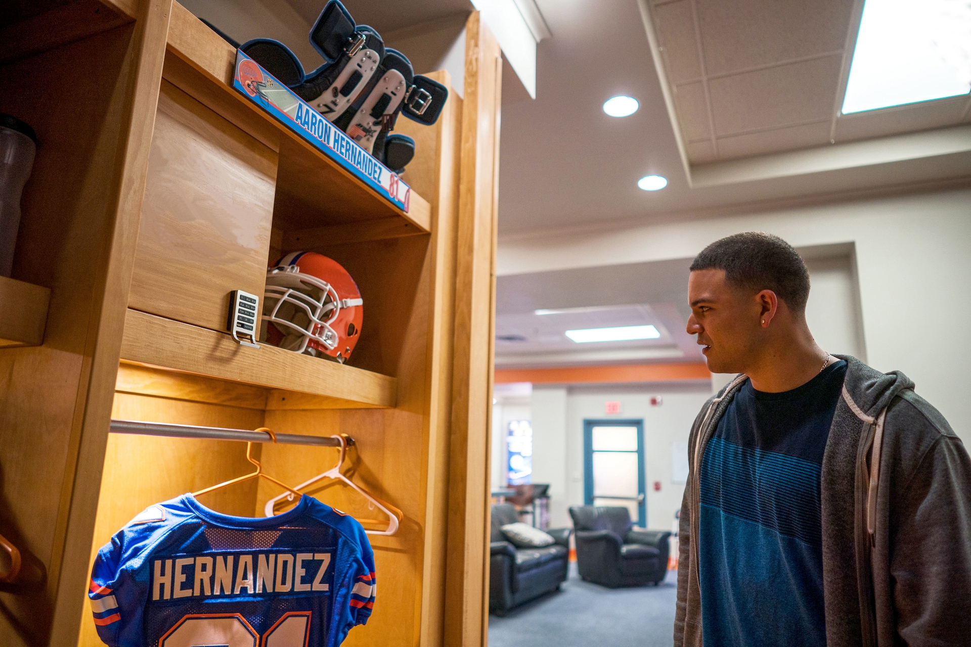 Hernandez stares at his jersey and helmet in the locker room