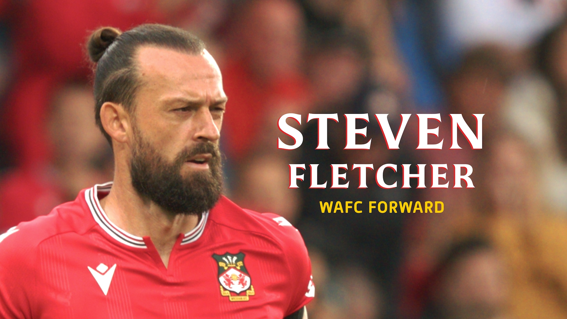 Steven Fletcher headshot, wearing his WAFC jersey and his hair pulled back in a neat bun.