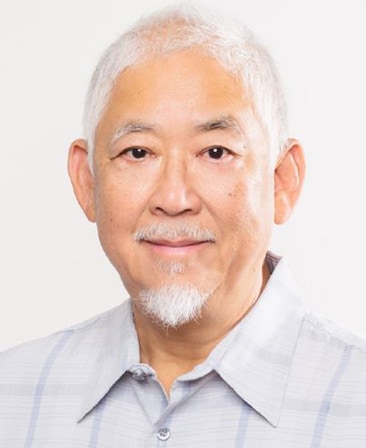 Victor Hsu headshot wearing a gray plaid collar shirt