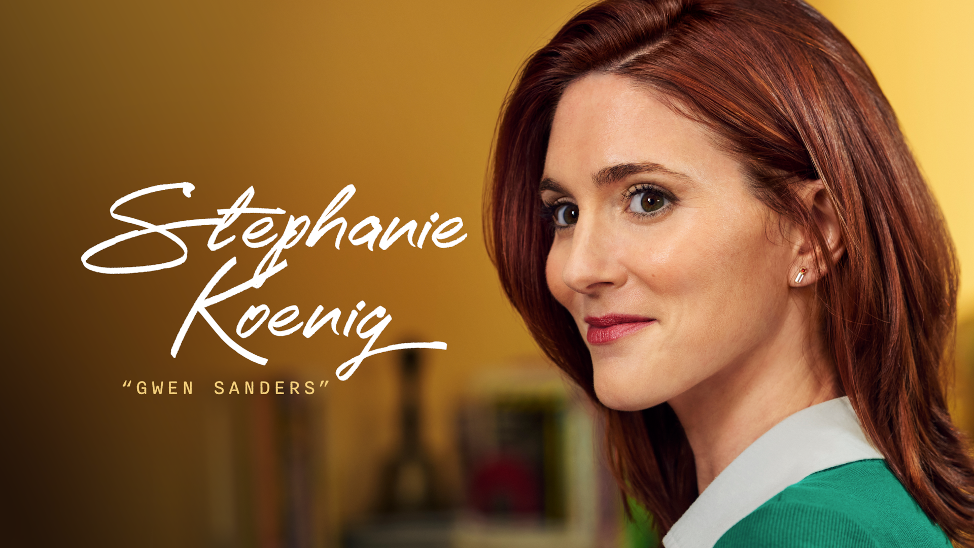 Stephanie Koenig as Gwen Sanders in FX's English Teacher wearing a bright green sweater and light collar, in a classroom.