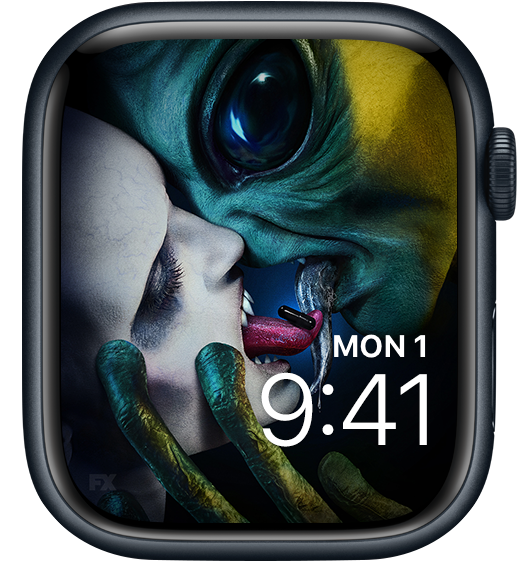 Apple Watch lock screen of alien and fanged monster swapping black pill with tongues from FX's AHS Double Feature