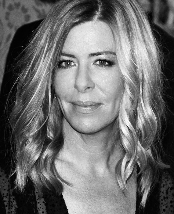 Dede Gardner black and white headshot wearing black sheer top 