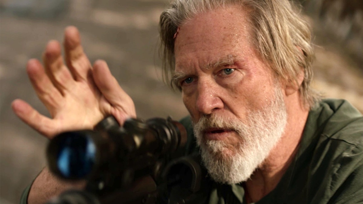 Close up of Dan Chase holding a gun