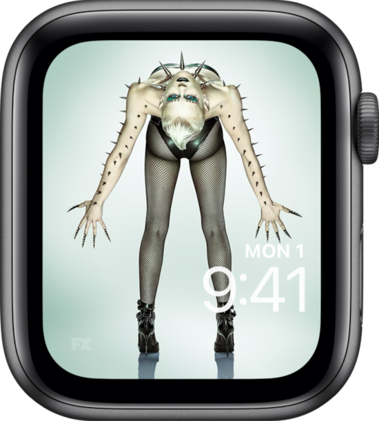 Apple Watch lock screen of person in heels and fishnet tights bending back with arms out from FX'S AHS NYC