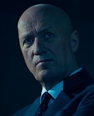 Headshot of Adrian Edmondson as Atom Eins