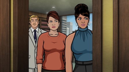 Lana, Pam and Ray standing in a room with buildings in the background