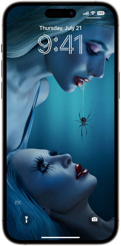 AHS: Delicate lock screen of a woman hovering over another with a spider dangling from her lips