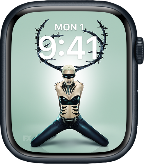 Apple Watch lock screen of person wearing black antlers with knees stretched in black pants for FX'S AHS NYC