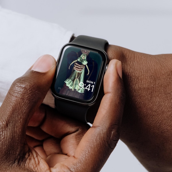 Man wearing Apple Watch with lock screen of man in uniform holding white bride doll from FX's American Horror Stories
