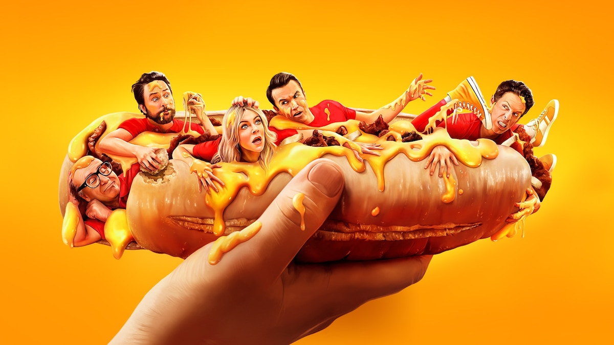 The Always Sunny cast crawling out of a large hotdog with ketchup and mustard.