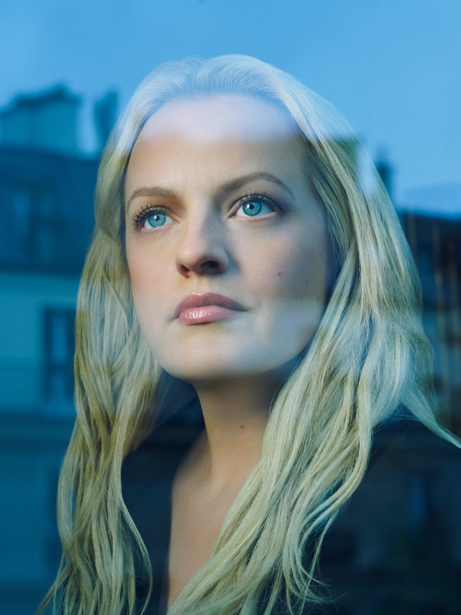Elisabeth Moss looking outside of a window for FX's The Veil