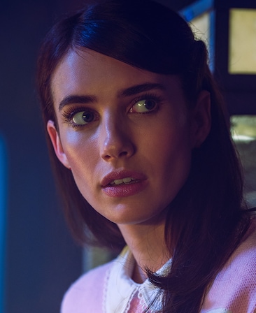 Emma Roberts headshot with hair down in pink dress and white collar from American Horror Story 1984
