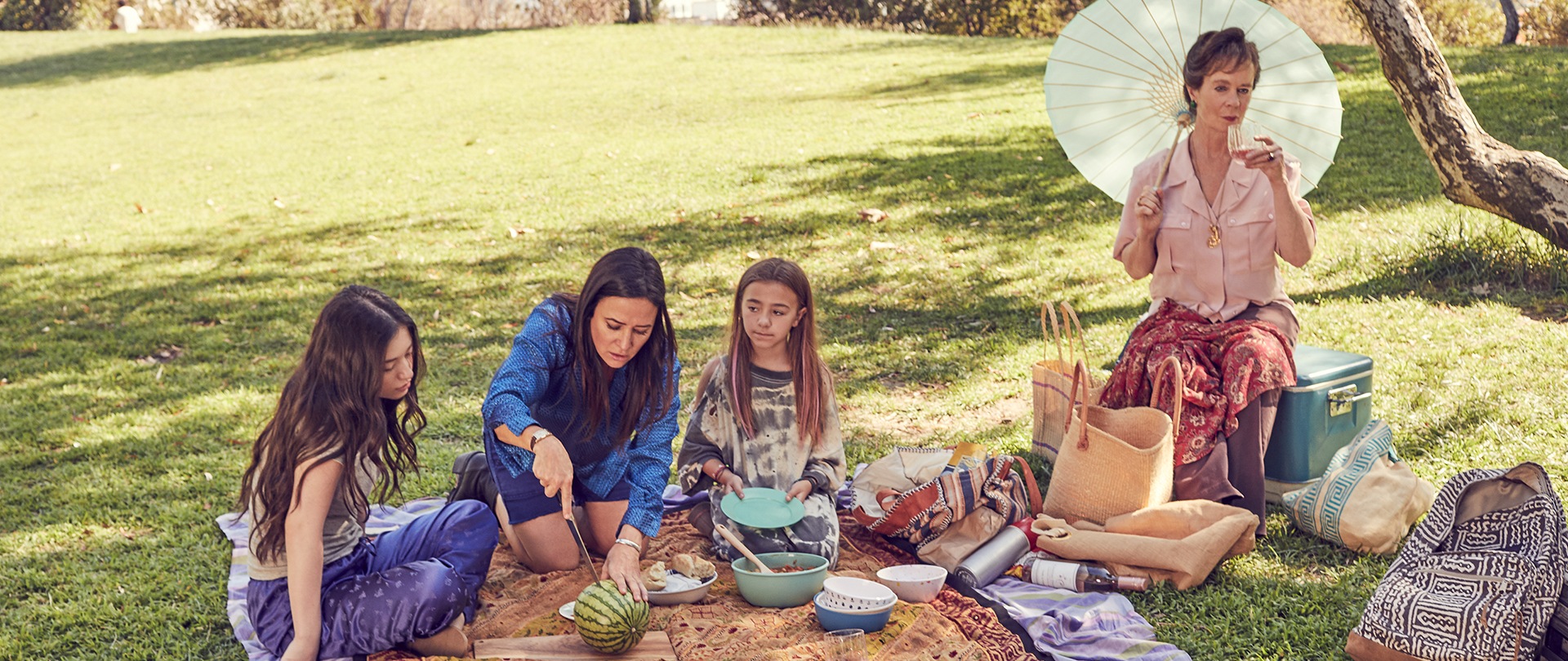 Cast of FX's Better Things having a picnic at the park.