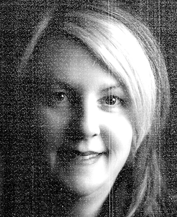 Rosemary Rodriguez headshot against a black background