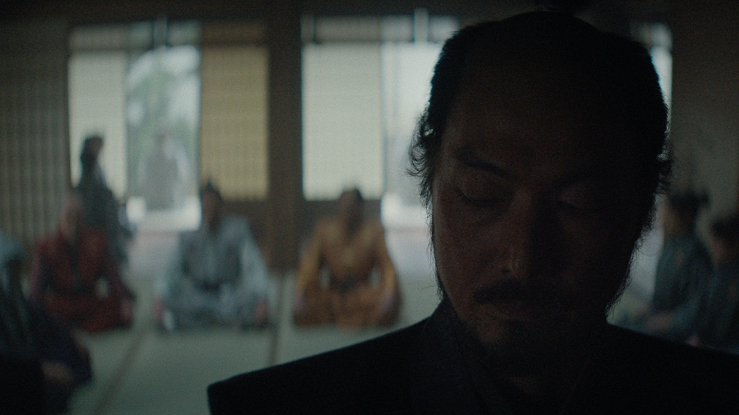 Close up of Ishido with the Council of Regents sitting in the background