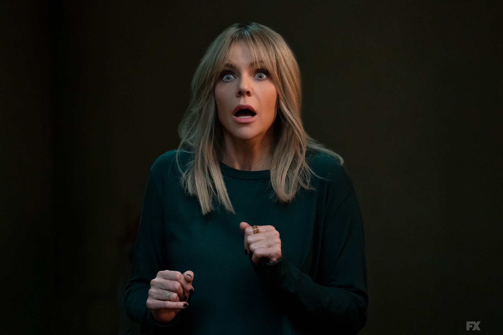 Dee centered blending into a dark background