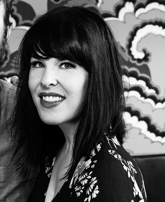 Alexis Martin Woodall wearing black and white floral top in black and white headshot