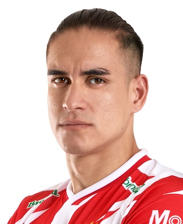 Alexis El Capi Pena headshot in a red and white jersey with his hair slicked back from FX's Necaxa.