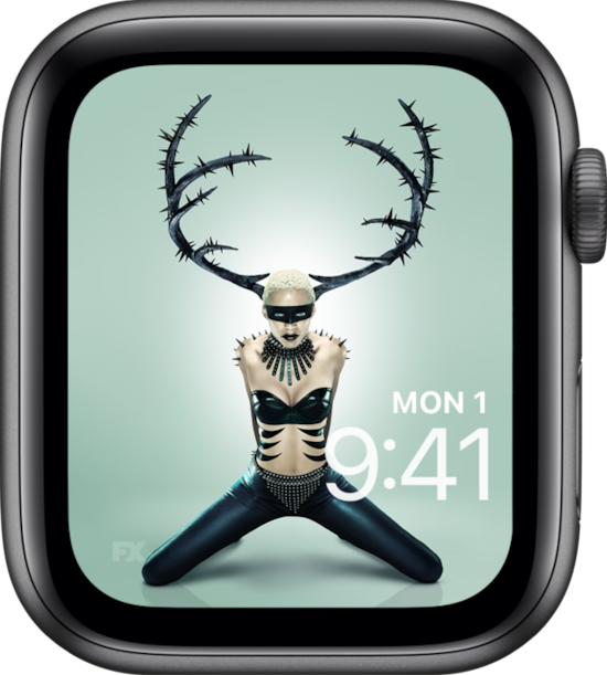 Apple Watch lock screen of person wearing black antlers with knees stretched in black pants for FX'S AHS NYC