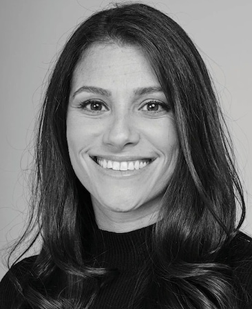 Black and white headshot of executive producer of FX's Necaxa, Jackie Cohn, wearing a black turtleneck.