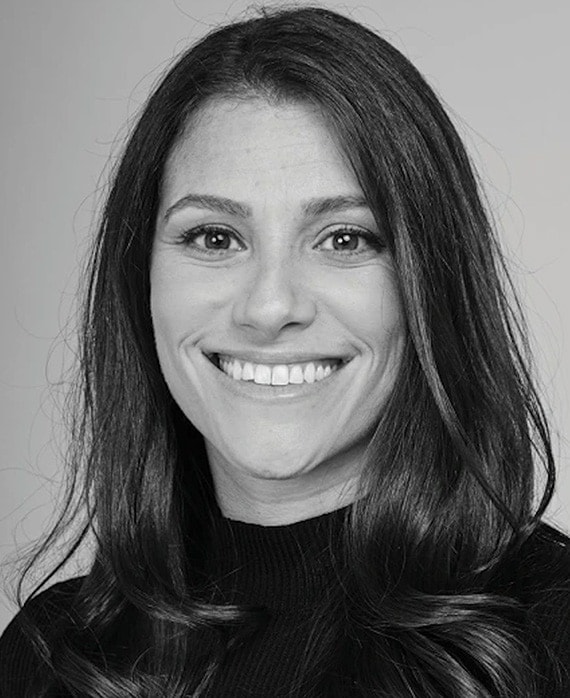 Black and white headshot of executive producer of FX's Necaxa, Jackie Cohn, wearing a black turtleneck.