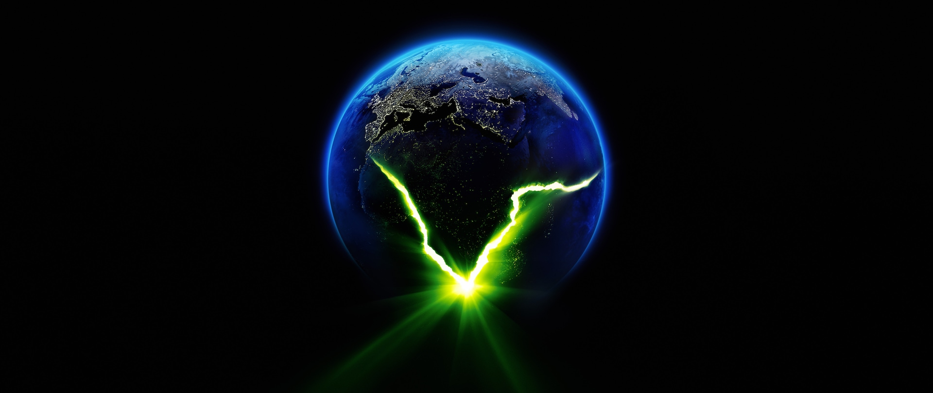 Earth cracking open with a green light coming from with.