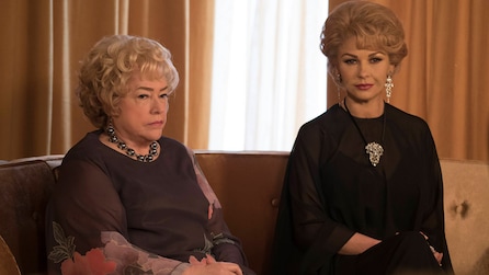 Kathy Bates as Joan Blondell and Catherine Zeta-Jones as Olivia de Havilland sitting on couch in Feud FX show