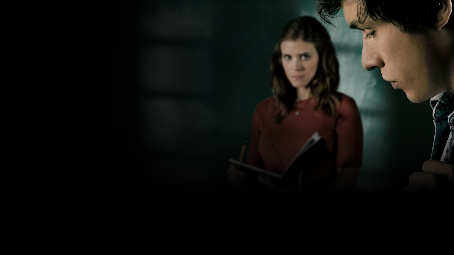 Kate Mara holding a book and Nick Robinson blurry in motion for FX's A Teacher