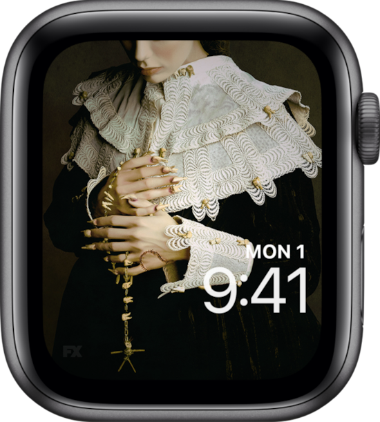 Apple Watch with lock screen of a person in pilgrim attire holding a necklace made of human teeth.