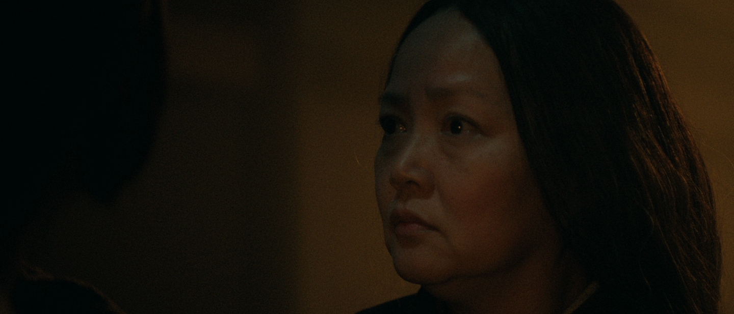 Toranaga's wife Kiri look across a dimly lit room