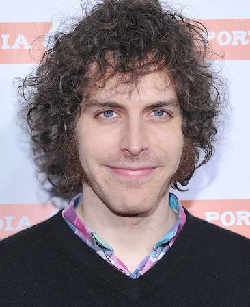 Headshot of executive producer / director Jonathan Krisel wearing a black sweater with a colorful shirt underneath.