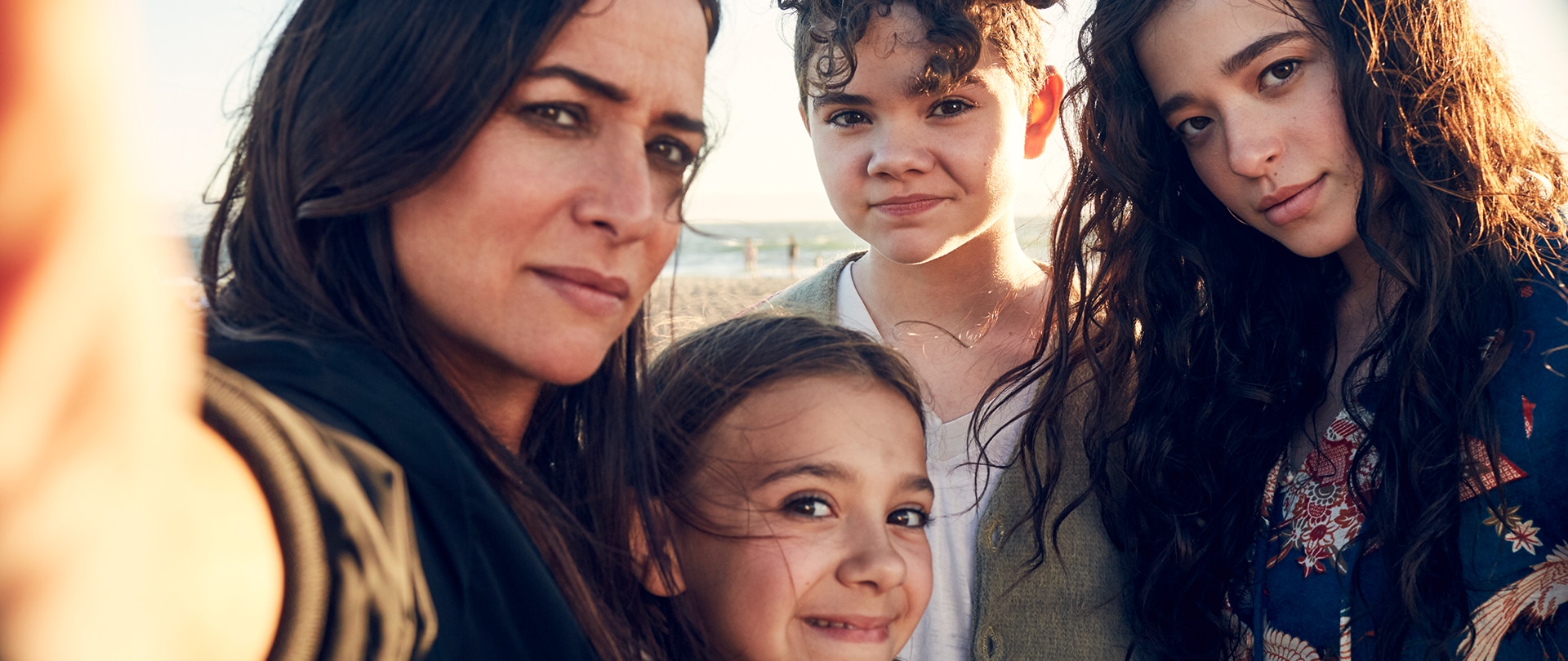 Cast of FX's Better Things at the beach taking a family selfie.