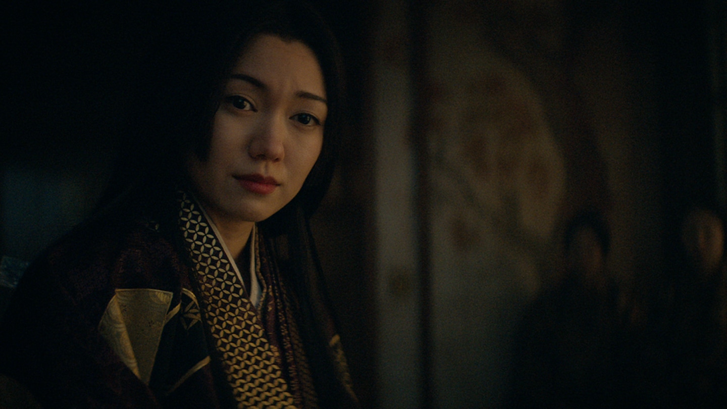 Close up of a tearful Ochiba looking at her son