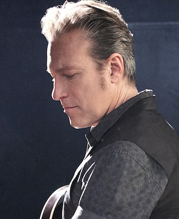 John Corbett headshot wearing a black shirt