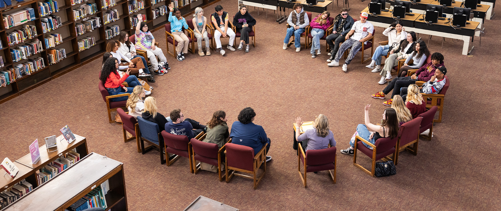 Group of students sitting around in a circle.