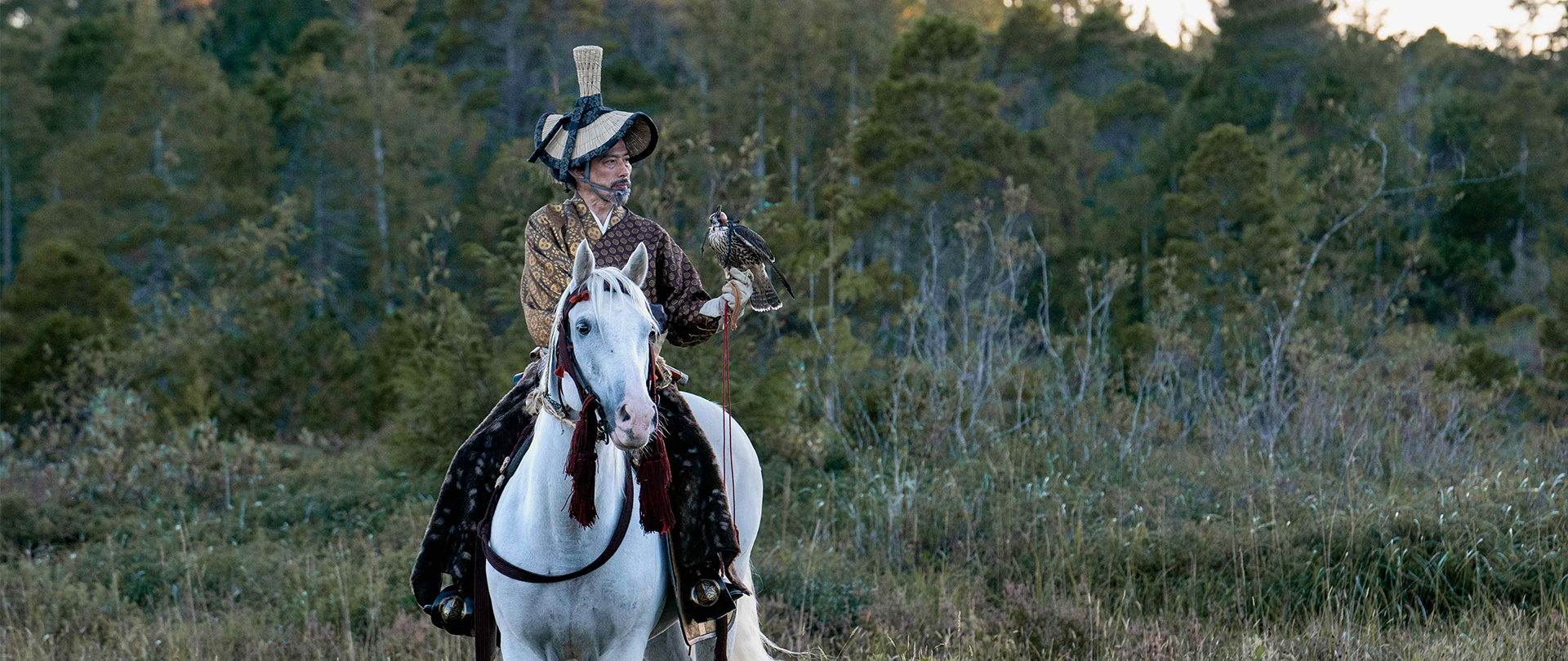 Toranaga on a white horse holding a falcon
