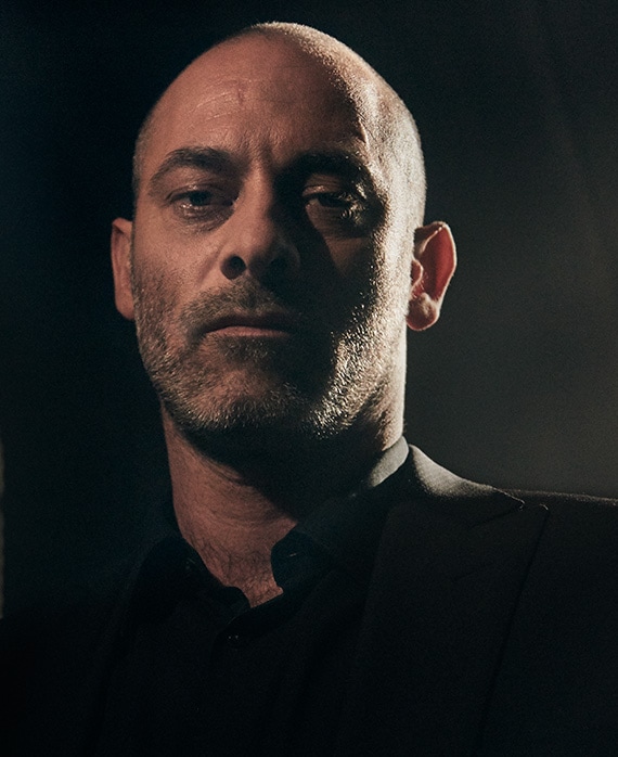 Ashraf Barhom headshot wearing a black shirt