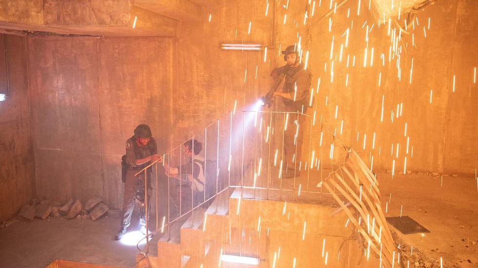 3 tactical soldiers on steps with sparks flying