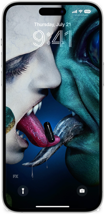 iPhone lock screen of alien and monster swapping black pill with tongues from FX's AHS Double Feature