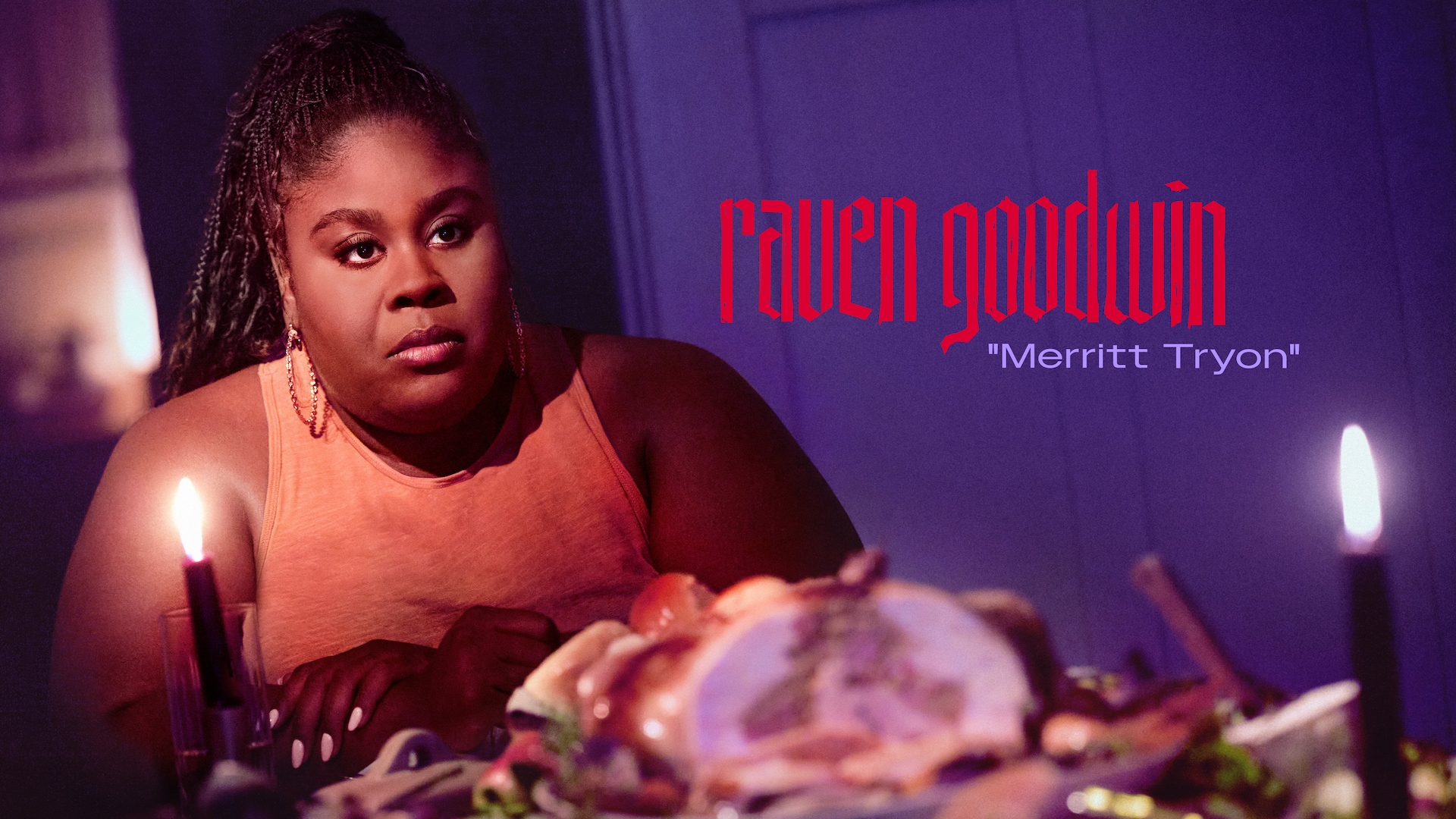 Raven Goodwin as Merritt Tryon in FX's Grotesquerie in an orange shirt, gold hoops, at a dinner table in a candle lit room..