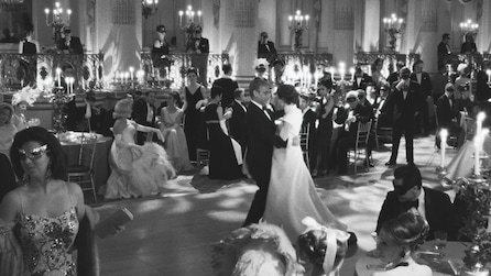 Truman Capote in the middle of a dance floor at a masquerade