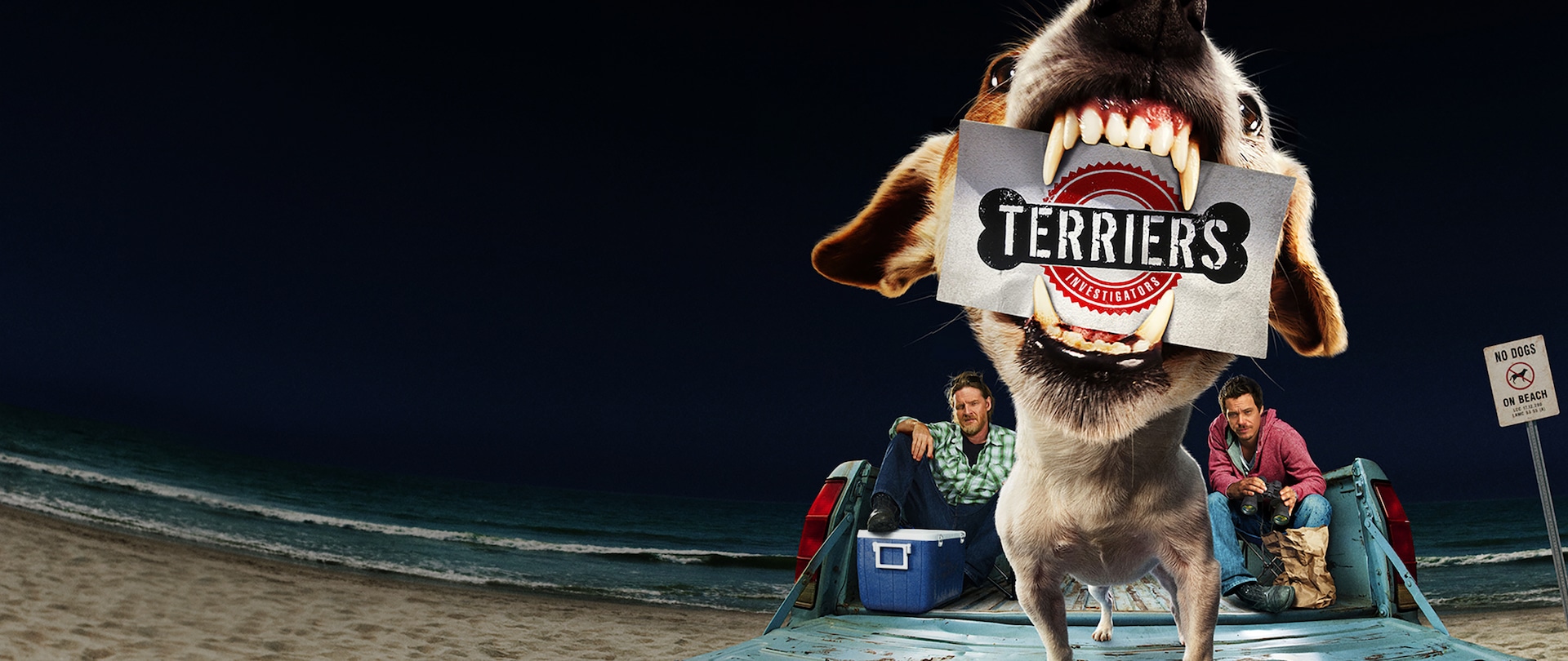 Two men sitting in back of a truck with a Chihuahua on the tailgate holding a Terriers Investigators business card in its jaw